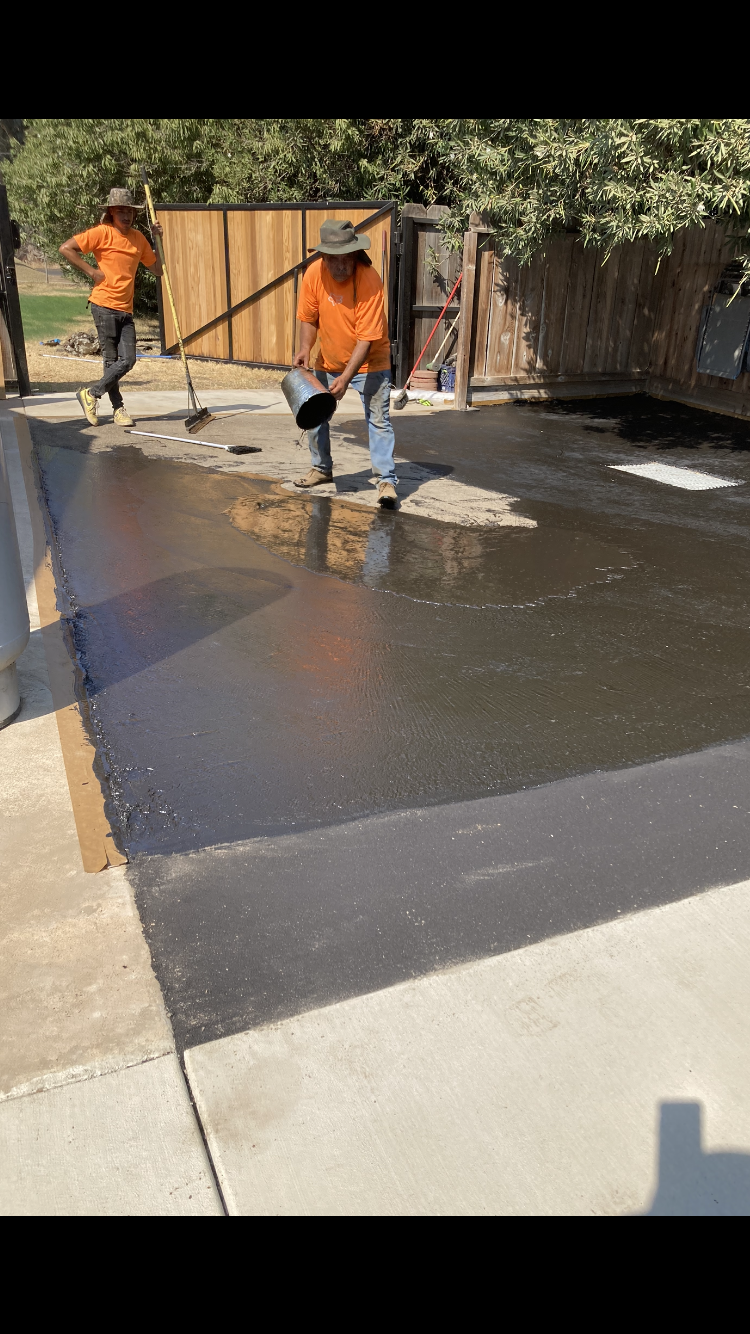 Torres General crew finishing a concrete driveway in Atwater